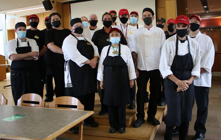 Cornell Dining Team, in masks, on the Bethe Dining stage